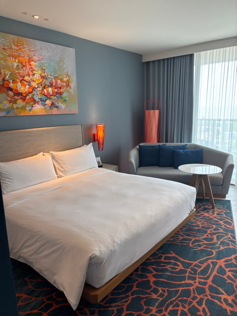 Spacious king bed room at Holiday Inn Resort Vana Nava Hua Hin, showcasing contemporary décor, soft lighting, and a comfortable sleeping area.